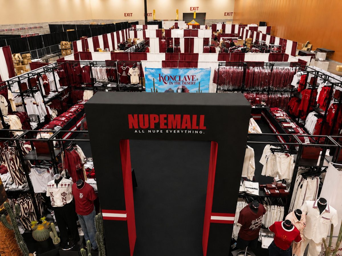 Overhead view of a fully built NUPEMALL apparel booth at a convention