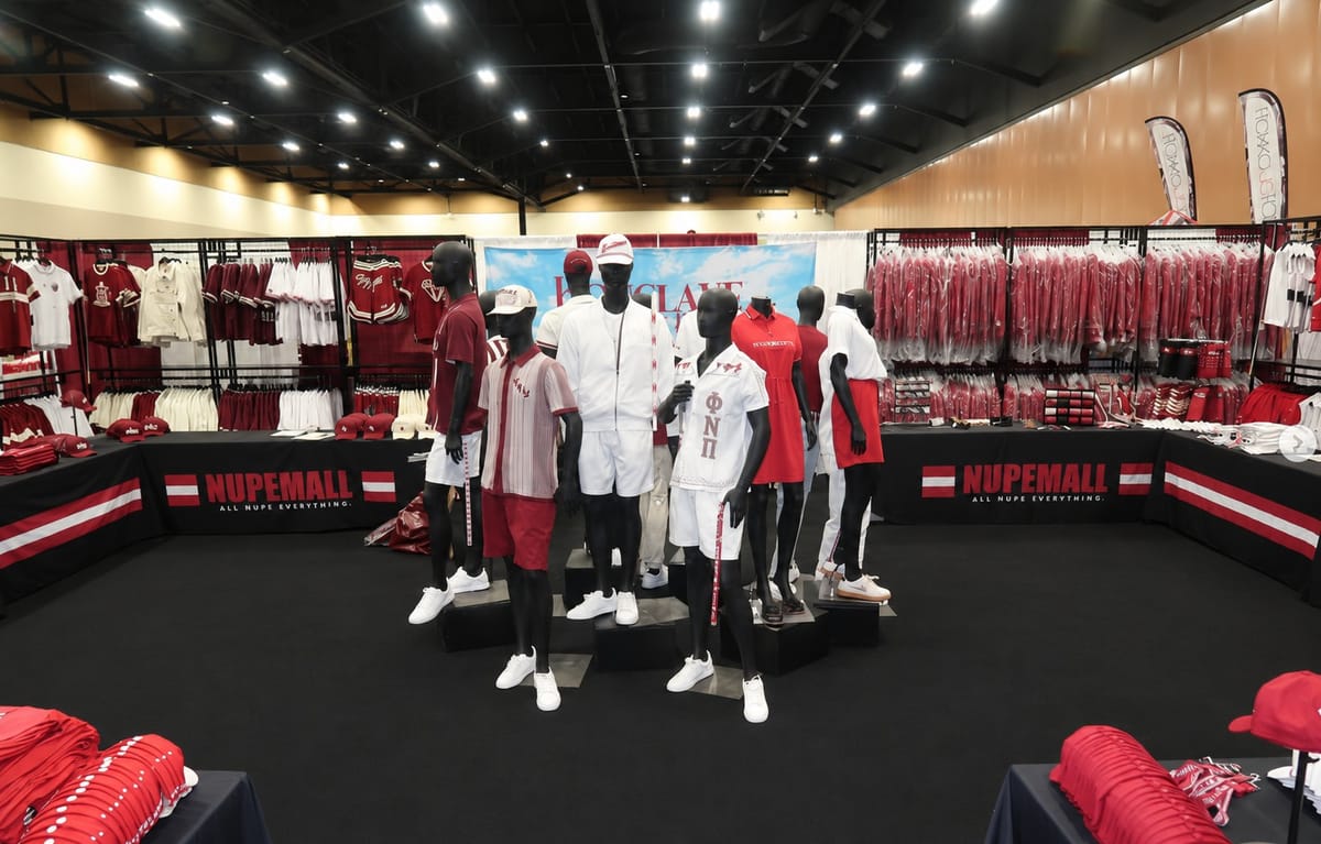 Mannequins dressed in red and white Kappa Alpha Psi apparel inside the NUPEMALL store