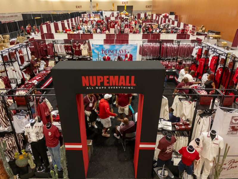 Overhead view of the NUPEMALL merchandise booth on a busy conclave floor